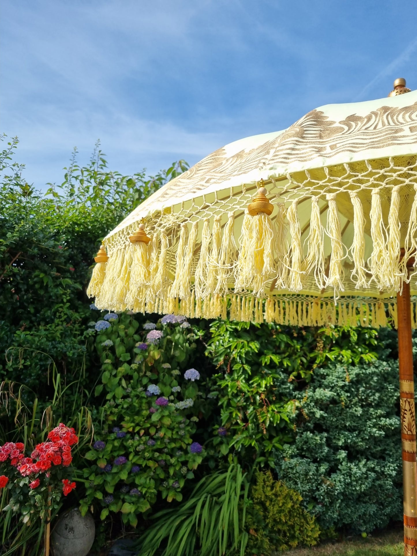 Close up fringe image of handmade yellow garden parasol uk