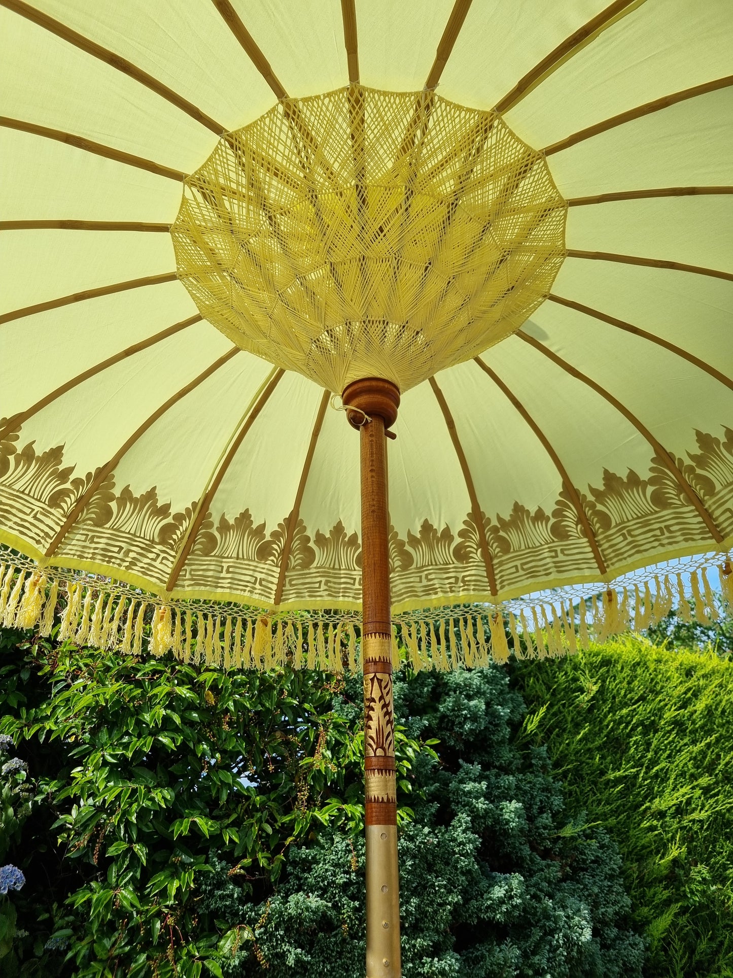Yellow bali parasol close up image handmade detailing inside parasol umbrella