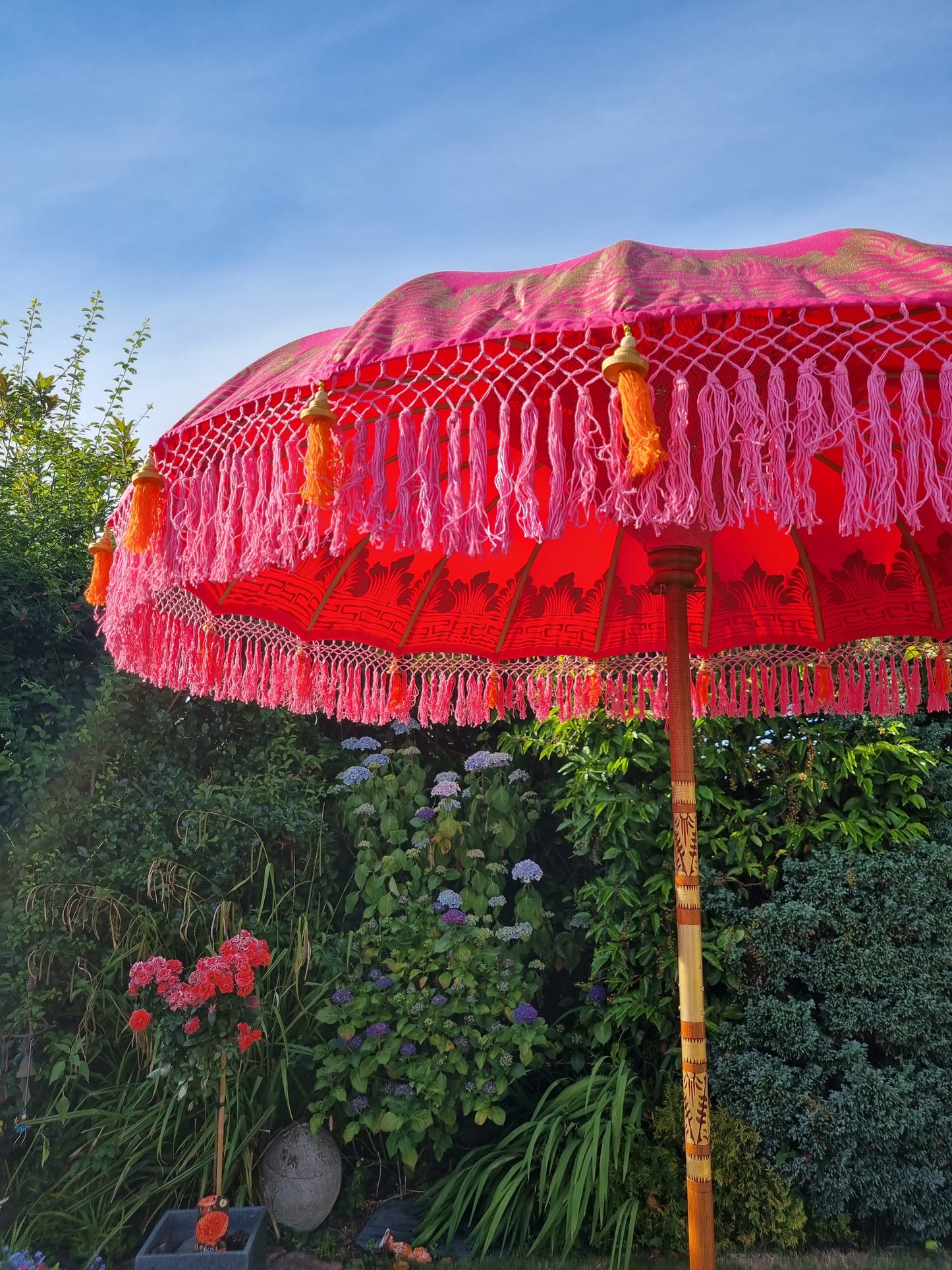 pink and orange ornament tassel bali balinese parasol image