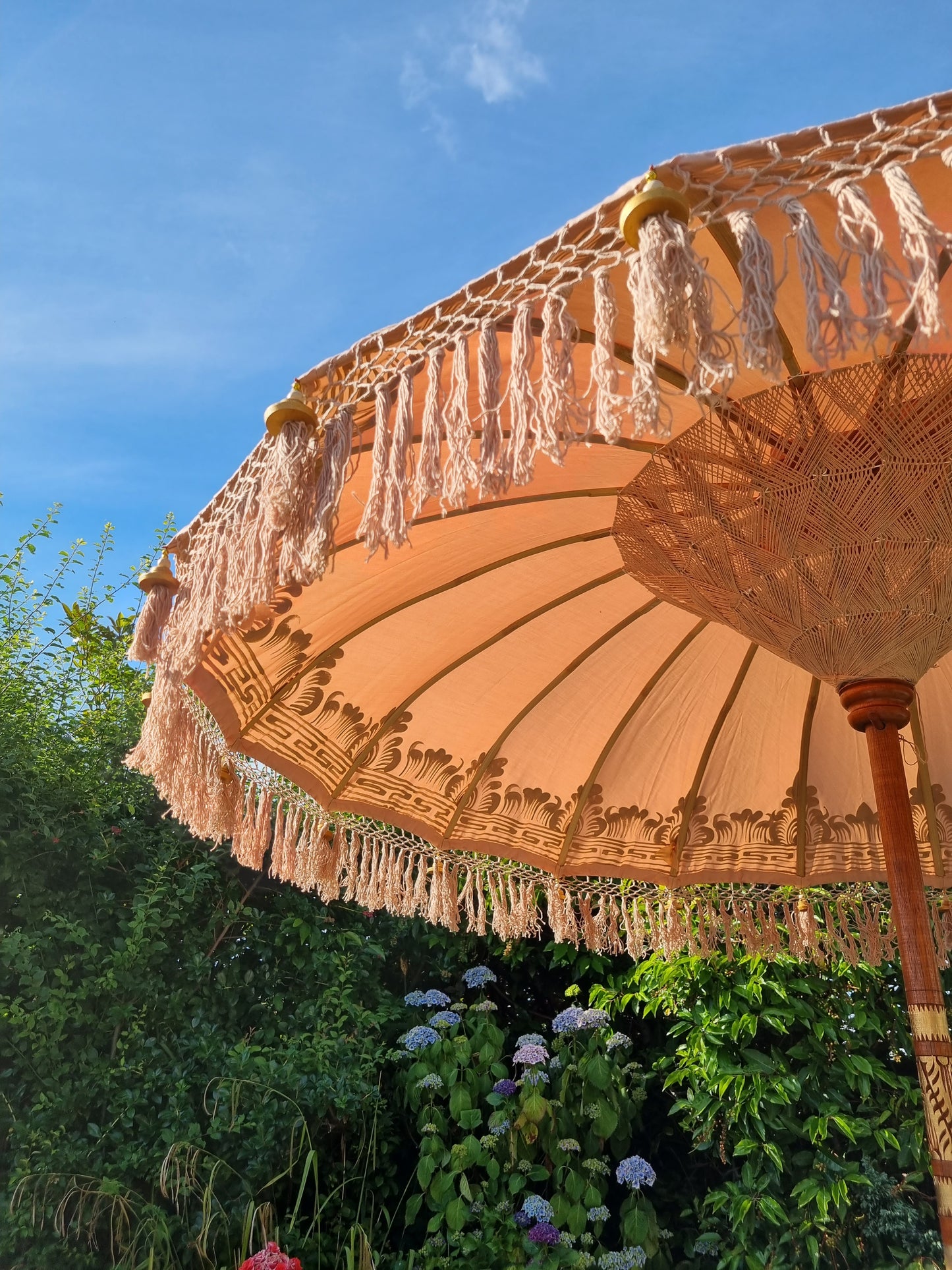 close up image of light brown with orange tone parasol umbrella