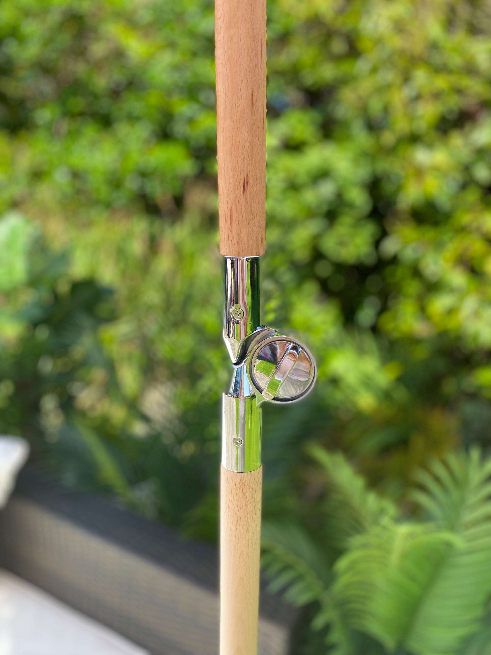 close up image of parasol hing tilt pole