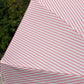 Close up image pink and white stripey parasol design